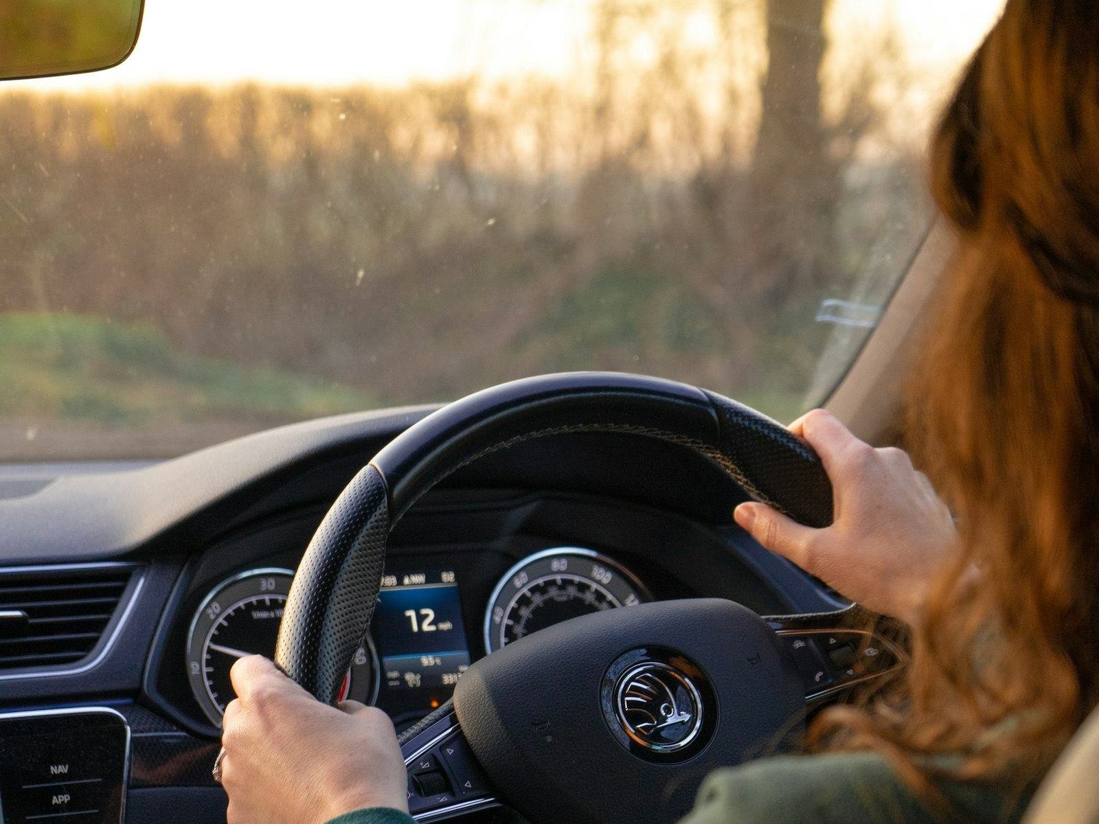 A learner driver holding the steering wheel