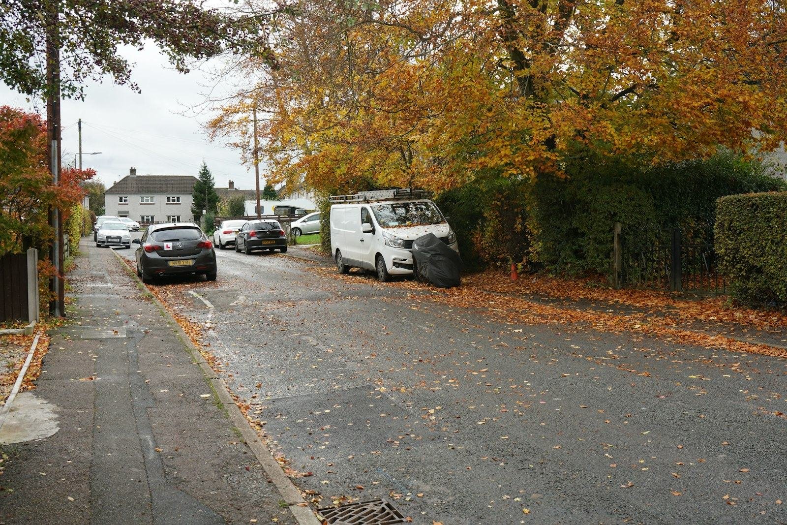 A quiet British residential street in autumn